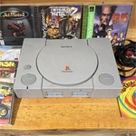 Sony Playstation Console Bundle + 12 Games And Demo Discs Tested Used. Price: $150.00.