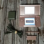 Nintendo Ds Lite Metallic Rose Handheld Video Game Console W/ Charger & Stylus Used. Price: $76.97.