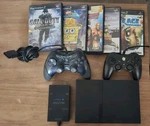 Sony Playstation 2 Slim Bundle + Sponge Bob Wwe Multitap Used. Price: $140.00.
