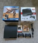 Sony Playstation PS3 Uncharted Console Gaming System 320GB Slim Bundle Box Used. Price: $250.00.