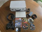 Sony Playstation 2 Slim Silver Bundle With Games, Cords, Mem Cards, Case Tested Used. Price: $125.00.