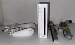 Nintendo Wii Console With Accessories Reset Model No. RVL-001 Used. Price: $59.99.
