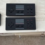 2 Wired Nes Controllers Black Gray. Stick About 650 For Nintendo Used. Price: $14.99.