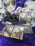 Sony Playstation 2 Slim Black Console Gaming System Bundle With Games Used. Price: $200.00.