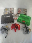 2 Nintendo 64 Consoles And Games Bundle - Jungle Green Black Used. Price: $320.00.