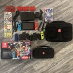 Nintendo Switch Mario Kart 8 Bundle W/ 4 Extra Games, Controllers & Storage Used. Price: $380.00.