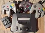 Nintendo N64 Charcoal Console +3 Controllers W/exc Joysticks) +cables Gd+ F/s Used. Price: $159.95.