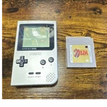 Nintendo Game Boy Pocket MGB-001 Silver Handheld System W/ Zelda Links Awakening Used. Price: $115.00.