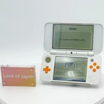 New Nintendo 2DS Xl Ll White Orange Console Japanese Ver Good Condition Tested Used. Price: $229.99.