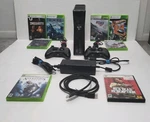 Xbox 360 Console Model 1439 + 2 Controllers Lot Of 8 Games Cables Used. Price: $350.00.
