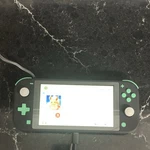 Nintendo Switch Lite Console Pok Mon Let's Go Eevee Game & Case Bundle Used. Price: $169.00.