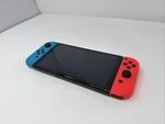 Nintendo Switch Oled Console With Blue And Red Joy-cons 64GB Good Condition Used. Price: $179.99.