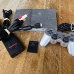 Silver Sony Playstation PS2 Slim Console Bundle SPCH-79001 Tested Working (#2) Used. Price: $125.00.