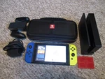 Nintendo Switch System 32GB Console W/neon Yellow & Blue Joy-cons +case Extras Used. Price: $169.95.