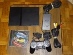 Sony Playstation PS2 Slim Black Console (SCPH-77001CB) W/ Game And Controller Used. Price: $90.00.