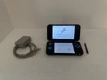 Nintendo 2DS Xl Turquoise Black Handheld Game Console + Charger JAN-001 & Stylus Used. Price: $250.00.