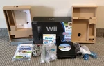 Nintendo Wii With Sports + Resort Black Console Complete Tested Used. Price: $144.99.