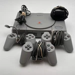 Sony Playstation (SCPH-1001) Silver Video Game System Used. Price: $75.99.