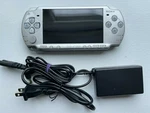 Sony Psp 2000 Console Ice Silver Good Condition + 4GB Card Charger- Tested Used. Price: $129.95.