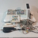 Nintendo Wii Console Bundle W/ Controllers, Balance Board. Used. Price: $85.00.