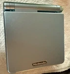 Nintendo Gameboy Advance Gba Sp Pearl Blue: AGS-101 + Charger & Case: Small Chip Used. Price: $149.95.