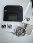 Nintendo 2DS Black/blue Handheld Console With Charger Games Used. Price: $99.99.