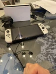 Nintendo Switch Oled Console Gaming System (white/black) + Memory Card Sleeve Used. Price: $200.00.