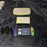Nintendo Switch Oled - Splatoon 3 Edition Bundle With Case Used. Price: $240.00.