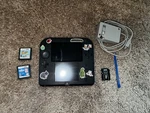 Nintendo 2DS FTR-001 Handheld Video Console (black/blue) W/ Games Used. Price: $120.00.