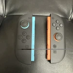 Nintendo Switch Joy-cons Pair Controller BEE-012, BEE-014 Red/neon Blue Open. Price: $70.00.