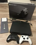 Microsoft Xbox One 1TB 4K Uhd Console Bundle W/ Box, Power Cord, 2 Controllers Open. Price: $200.00.