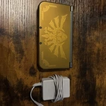 New Nintendo 3DS Xl Zelda Hyrule Edition W/ Charger - Authentic & Tested Used. Price: $550.00.