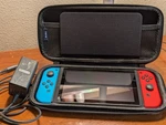 Gently Used: Nintendo Switch, Neon Red/blue Joy Cons, Power Brick, Carrying Case. Price: $175.00.