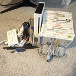 Nintendo Wii RVL-001(USA) Console Bundle W/ 10* Games Used. Price: $100.00.
