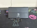 Nintendo Switch Oled Model HEG-001 Tablet Only 64GB Used. Price: $160.00.