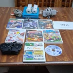 Nintendo Wii Original Console Bundle With Controllers, Mario & Sports Games Open. Price: $105.85.