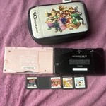 Nintendo Ds Lite 2 Consoles Pink & Black, Super Mario Case, 4 Action Games Used. Price: $160.00.