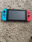 Nintendo Switch Console With Neon Red And Blue Joy-con Controllers Used. Price: $142.00.