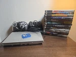 Sony PS2 Slim Console SCPH-90001 Bundle With 13 Games Controllers Used. Price: $189.99.