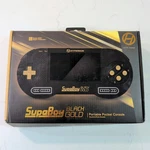 Hyperkin Supaboy - Black Gold Model Portable System For Snes And Super Famicom Used. Price: $110.00.