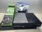 Microsoft Xbox One 1TB Model #1540 Console W/ Controller, Cables & 9 Games Used. Price: $140.00.