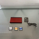 Nintendo Lite Authentic Console Crimson Handheld System W/ Charger & Stylus Used. Price: $140.00.