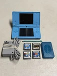 Nintendo Dsi Light Blue Handheld Console System W/ Charger & 4 Used. Price: $89.99.
