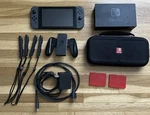 Nintendo Switch Gray Joy-con Console With Dock, Case & Accessories. Used. Price: $245.00.