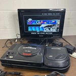 Sega Genesis Model 1601 Cd MK-4102 Controllers Working No Cords Used. Price: $249.95.