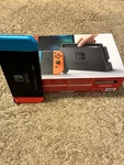 Nintendo Switch 32GB Handheld Console - Red/neon Blue Open. Price: $240.00.