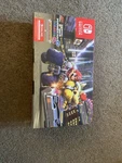 Hand Nintendo Switch With Neon Blue & Red Joy-con + Mario Kart 8 Deluxe Brand. Price: $414.98.