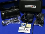 Nintendo 3DS Cosmo Black Console Case, Earbuds, 1 Stylus, Charger + 4 Games Used. Price: $185.78.