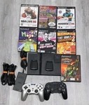 Sony PS2 Slim Console Bundle W/ 7 Games/ Mem/ & Wireless Controller Tested Used. Price: $170.00.