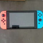 Nintendo Switch Low Serial XAW1 Used. Price: $190.00.